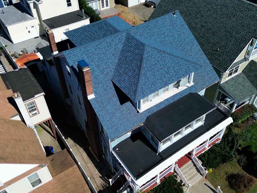 Professional roofing contractor providing emergency roof repair services for a damaged residential roof.